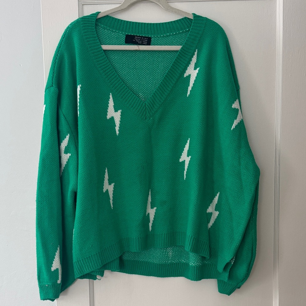 Dressed in LALA Green V-Neck Sweater with White Lightning Bolts